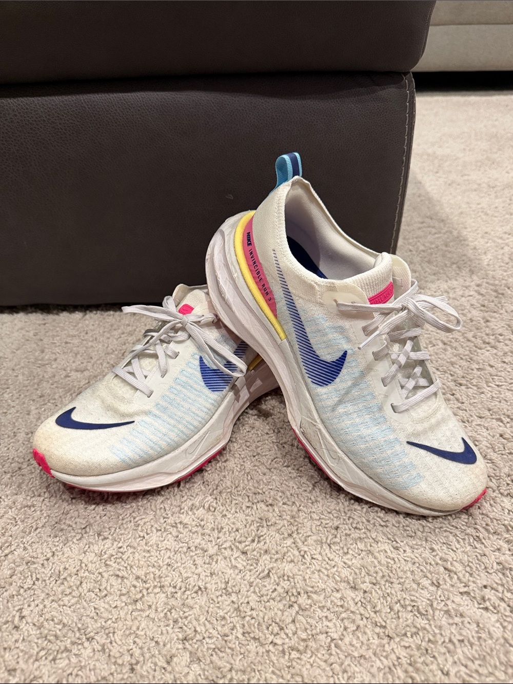 Nike Kids White Sneakers with Blue Swoosh and Pink Accents